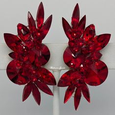 Designed with lots of different crystals, including a rivoli center in an elongated top and bottom spray design. This is a larger earring and creates lots of sparkle These beautiful earrings are 2 x 1 inch in size Red Crystal Jewelry, Different Crystals, Pinterest Design, Yellow Pearl, Large Crystal, Red Rhinestone, Purple Crystals, Red Crystals, Large Earrings