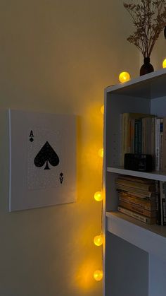 a book shelf filled with books and lights