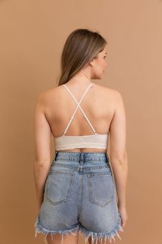 Get ready to add a touch of style to your summer wardrobe with our Floral Jacquard Scoop Neck Bralette! Perfect for any summer outfit, this bralette is also a must-have for your next vacation. Embrace a stylish and fun look with our soft and trendy design. Don't miss out on this cute addition to your closet! #lovemyleto 52% Nylon 40% Rayon 8% Spandex Imported Beach Lace Crop Top With Built-in Bra, Chic Beach Camisole With Built-in Bra, Stretch Camisole With Built-in Bra For Day Out, Stretch Triangle Crop Top With Built-in Bra, Camisole Crop Top With Built-in Bra For Vacation, Trendy Cropped Seamless Bra, Vacation Halter Cami Top With Built-in Bra, Feminine Camisole With Built-in Bra For Vacation, Trendy Fitted Summer Bra