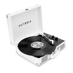 an open suitcase with a record player and vinyl on the inside is shown in black and white