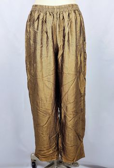 - Size: 20 Women's Petite - Condition: Vintage item in good, used condition. Overall, these pants looks well preserved and cared for. Sold AS IS. **See pictures** - Production Era: 1990s/1980s Terms of Sale Our unique finds may exhibit signs of wear indicative of their prior use and age, which we believe only adds to their vintage charm. Because these items have likely been loved by a few other hands before reaching ours, we cannot guarantee the specific storage conditions they've encountered ov Gold Silk Bottoms For Party, Party Silk Bottoms With Elastic Waistband, Silk Party Bottoms With Elastic Waistband, Festive Fitted Harem Bottoms, Festive Wide Leg Silk Pants, Festive Wide Leg Silk Bottoms, High Waisted Palazzo Pants, Size 20 Women, Disco Pants