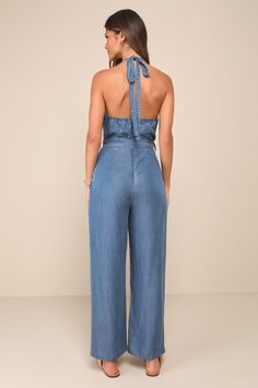 Everyone will wanna copy your breezy look in the Lulus Always Imitated Blue Chambray Halter Wide-Leg Jumpsuit! Lightweight woven chambray fabric shapes this effortless jumpsuit that has a tying halter neckline and a princess-seamed bodice with a functional button placket at the front. Belt loops and a removable sash belt accent the waist, atop wide-leg pants (with front diagonal pockets) that finish at full-length hems. Elastic and hidden zipper/clasp at back. Fit: This garment fits true to size Chambray Jumpsuit, Chambray Fabric, Adhesive Bra, Sash Belts, Sash Belt, Wide Legs, Halter Neckline, Strapless Bra, Wide Leg Jumpsuit