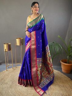 Wear this gorgeous blue paithani silk saree and experience the epitome of elegance and grace. Crafted with delicate zari weaving work and adorned with exquisite golden motifs all over, this silk saree is a true masterpiece. The rich pallu adds an extra touch of sophistication and luxury, making you stand out on any occasion.
The saree comes with a matching color silk fabric blouse that also features intricate zari weaving work, perfectly complementing the saree's design. Both the saree and the b Paithani Silk Saree, Blue Silk Saree, Paithani Saree, Kanjivaram Sarees, Wedding Saree, Silk Wedding, Blouse Material, Indian Attire, Traditional Sarees