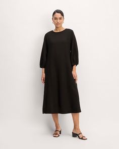 About This Style. This piece features a midi length, crew neckline, waisted A-line silhouette, side pockets, full lining, and long sleeves, made with 100% linen.