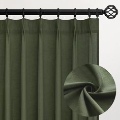 a green curtain with black metal rod ends and an image of the fabric in front of it