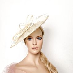 Cream sinamay derby fascinator, Ivory fascinator hat, bow feathers derby hat, Beige wedding hat, Royal ascot hat, women racing hat, saucer This cream sinamay fascinate hat is embellished with a big bow and two arrow feathers.It is a perfect hat for weddings, Royal Ascot horse races, cocktails, derby...It is mounted on a headband.If you want, you can choose the side of the head were you like to wear the fascinator, just convo me.Any color of the fascinator can be changed to order. Ascot Horse Racing, Ivory Fascinator, Horse Races, Royal Ascot Hats, Derby Fascinator, Ascot Hats, Beige Wedding, Wedding Hat, Fascinator Hat