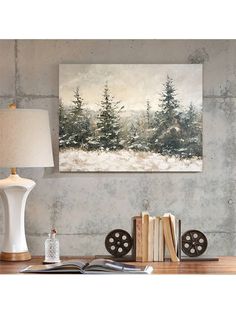 a painting hanging on the wall next to a lamp and bookshelf in front of it