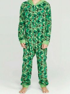 Boys MINECRAFT One Piece Pajamas Union Suit Extra Small Free Shipping!  Condition is New with tags.  100% polyester Front Zipper With this Minecraft one piece pajamas,  your video game fan can stay comfortable while he's playing his favorite game!  This green long-sleeve union suit showcases an allover print of green Creeper faces, with a coordinating Creeper print on the hood for the complete style.  It also features a half-length front zipper for easy dressing, and the banded cuffs help provid Green Cotton Sleepwear For Lounging, Casual Printed Onesie For Loungewear, Casual Printed Loungewear Onesie, Casual Printed Onesie For Bedtime, Green Printed Sleepwear For Sleepover, Casual Cotton Onesie For Sleepover, Green Casual Sleep Onesie, Casual Green Christmas Sets, Casual Christmas Sleepwear For Home