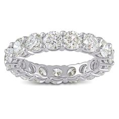 an oval cut diamond ring with rows of round stones on the side and sides, set in