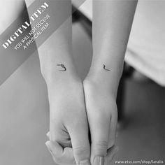 two people holding hands with small tattoos on their arms and the words,'i love you