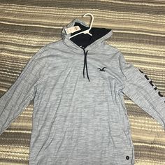 Brand New With Tags Hollister Sweatshirt Casual Sports Hoodie Top, Casual Hooded Sports T-shirt, Casual Hooded T-shirt, Casual Hoodie Top For Loungewear, Casual Sports T-shirt For Winter, Casual Winter Sports T-shirt, Casual Blue Hooded T-shirt, Hollister Sweatshirt, Hollister Logo