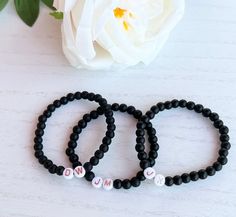 Black Beaded Initial Bracelet -JM,DW,JK ❋ Listing is for one Black Beaded Bracelet with initials on an elastic cord ❋ Rose Gold Letter Beads ❋ Round Black Glass Beads ❋ One size fits most  ❋ Colors may vary due to lighting ☆ Perfect for wearing alone or stacking with our other beaded bracelets  ☆ Make sure to pick the correct initials for your Favorite Guy  ❤️Care Tips❤️ ❋ Best to keep away from water and direct sunlight  ❋ Materials can be fragile if dropped or if band is stretched  ❋ Please ro Bracelet With Initials, Black Bead Bracelet, Heishi Bead Bracelet, Initial Bracelets, Black Beaded Bracelet, Bracelets Black, Jordans Girls, Bracelet Initial, Jewelry Rose Gold