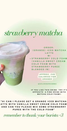 a hand holding up a green drink in front of a white background with the words strawberry matcha on it