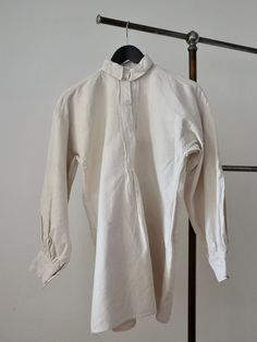 "C.1930s Hungarian linen shirt. Traditional folk clothing. Homespun linen. Opaque white glass buttons. Lovely simple cut.  Measures: 20 1/2\" underarm to underarm, 20 1/2\" across the shoulders, 9 1/2\" from shoulder to underarm, 20 1/2\" sleeves, 14\" collar, 28 1/2\" from top of the shoulder to hem. Great condition. Freshly laundered. The seams at the left underarm need some repair stitches as just a very small split here.  Feel free to ask any questions. Ships internationally via insured deli Vintage Linen Shirt With Buttons, Vintage Linen Shirt With Button Closure, Vintage Linen Shirt With Relaxed Fit, Vintage Linen Button-up Tops, Linen Shirt With Button Cuffs For Daywear, Cream Linen Tops With Buttons, Cream Linen Top With Buttons, Vintage Linen Blouse With Buttons, Fitted Linen Blouse With Button Cuffs