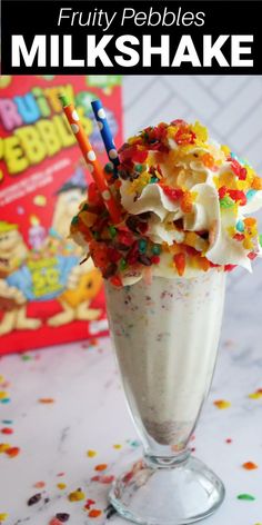 fruity pebbles milkshake with sprinkles and candy on the top