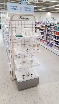 an empty pharmacy store with the shelves filled with medicine and other items for sale on display