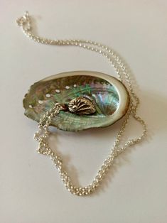 This pendant is a sterling silver reproduction of a real Haliotis (abalone), obtained by lost wax casting. Chain not included. Unique Shell-shaped Silver Necklace, Abalone Shell Round Pendant Jewelry Gift, Silver Shell-shaped Jewelry Gift, Silver Shell-shaped Necklace For Gift, Unique Sterling Silver Shell Jewelry, Unique Shell-shaped Silver Jewelry, Unique Silver Shell-shaped Jewelry, Unique Silver Abalone Shell Necklace, Vintage Abalone Shell Jewelry Gift