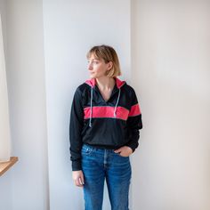 Vintage hoodie in black and pink colours.  The jumper has front pockets and quarter front zip Precise measurements are shown in the picture. Model usually wears size M and is 168 height. Condition: excellent vintage condition.  Every piece in this shop is hand selected from different places.   All those garments are bought second hand, that is why they are always unique and sometimes might have imperfections.  Choose circular fashion over fast fashion and create your own style. I hope you love y Black Half-zip Hoodie With Drawstring Hood, Black Half-zip Hoodie, Black Half-zip Hoodie Sportswear, Black Athleisure Hooded Jacket With Kangaroo Pocket, Black Hooded Jacket With Kangaroo Pocket For Athleisure, Black Sporty Hoodie Windbreaker, Sporty Black Hoodie Windbreaker, Sporty Pink Outerwear With Kangaroo Pocket, Pink Sporty Outerwear With Kangaroo Pocket