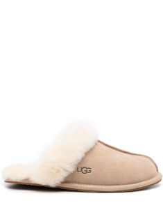 sand beige calf suede debossed logo to the side raised seam detail round toe sheepskin branded insole flat rubber sole slip-on style We've partnered with Good On You — an independent agency that rates how brands perform in relation to their impact on the planet, people and animals, with a multi-criteria rating simplified to a five points scale. In order to be awarded our conscious label, larger brands need to score a minimum of four out of five ('Good'), while smaller brands must score at least Ugg Scuffette Slippers, Ugg Mules, Ugg Slipper, Ugg Scuffette, White Slippers, Sheepskin Slippers, Slide Slippers, Debossed Logo, Planet People