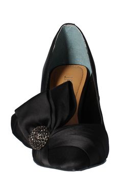 An oversized bow details the side of a glamorous pointy-toe pump lifted by a slim heel. 3" heel Textile or synthetic upper/synthetic lining and sole Imported Satchel Tote, Dillard's, Bow Detail, Black Pumps, Women's Pumps, Stiletto Heels, Fashion Shoes, Latest Trends, High Heels