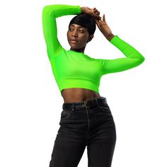 This long-sleeve crop top is made of recycled polyester and elastane, making it an eco-friendly choice for swimming, sports, or athleisure outfits. The crop top has a tear-away care label and a wide, double-layered waistline band for a comfortable fit. Solid color with "Runway Girlz" on the side. • Fabric composition in Europe: 88% recycled polyester, 12% elastane • Fabric weight in Europe: 6.78 oz/yd² (230 g/m²) • Fabric composition in Mexico: 81% REPREVE recycled polyester, 19% LYCRA® XTRA LIF Sporty Long Sleeve Elastane Crop Top, Green Stretch Crop Top, Stretch Green Elastane Crop Top, Trendy Cropped High Stretch Activewear, Trendy High-stretch Cropped Activewear, Trendy High Stretch Cropped Activewear, High Stretch Green Cropped Tops, High Stretch Cropped Green Tops, Trendy High Stretch Sports Crop Top