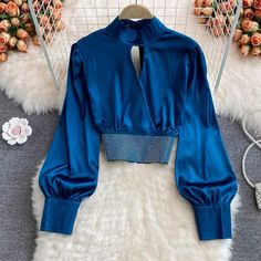 Stand collar, hollow out, short style, hot drill, satin shirt with bubble sleeve, fashionable short style topMaterial:satinColor:white,black,blue,redStyle:stylishFeature:bubble sleeve,stylishSize(CM):free 1inch=2.54cmlength:44,bust:94,sleeve:62&ltp&gtAll items will arrive in about 20-25 business days, if you have an emergency, please contact us to upgrade logistics.</p>&ltbr/>&ltp&gtNeed to add 16 dollars fast shipping(Arrive in 10-14 days).</p>&ltbr/> Blue Long Sleeve Satin Top, Blue Satin Long Sleeve Top, Trendy Long Sleeve Satin Tops, Trendy Satin Top For Parties, Satin Padded Blouse For Night Out, Padded Satin Blouse For Night Out, Trendy Fitted Satin Blouse, Blue Satin Party Blouse, Cutout Tops