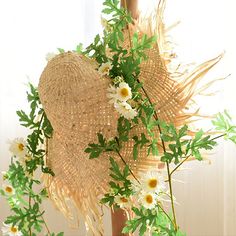 Handcrafted natural straw hat with silk-like flowers and vines, spring-like daisies and green leaves complement each other to enhance the authenticity.(This product needs to be compressed and transported with artificial flowers and straw hats. After unpacking, you can refer to the pictures to organize and restore them. Due to the blooming conditions of the artificial flowers, the height and width of the product may vary slightly.) Handmade Straw Hat For Garden Party In Summer, Handmade Straw Hat For Summer Garden Party, Whimsical Handmade Straw Hat For Summer, Natural Palm Leaf Straw Hat For Spring, Bohemian Beige Sun Hat For Garden Party, Bohemian Spring Hats For Picnic, Bohemian Hats For Spring Picnic, Eco-friendly Woven Sun Hat For Spring, Whimsical Straw Hat For Summer Beach