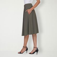 Strut or twirl with confidence in this light and breezy flared skirt. Perfect for keeping cool on a hot summer's day or for adding a touch of style whether you're off to work or a night on the town, this polyester and spandex skirt is as versatile as it is alluring.Front Style: Flat FrontFeatures: Stretch FabricClosure Type: Full ElasticPockets: 2 Side Slip PocketsRise: Mid RiseApparel Length: 23 InchesFiber Content: 95% Polyester, 5% SpandexFabric Description: KnitLining: UnlinedSkirt Length: Casual A-line Bottoms For Day Out, Chic Summer A-line Maxi Skirt, Elegant Summer Skort In Solid Color, Flowy A-line Maxi Skirt With Pleated Waist, Chic Stretch A-line Skirt, Summer Workwear Knee-length Skirt, Chic A-line Pleated Summer Skirt, Flared Maxi Skirt With Ruffles For Day Out, Stretch A-line Gathered Skirt Bottoms