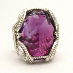 "Bold Handmade Sterling Silver Wire Wrapped Genuine Amethyst Ring Stunning Deep Purple Birthstone for February Sizing and shipping is ALWAYS FREE with a 14 day \"No Questions Asked\" return policy. lifetime warranty, free sizing and cleaning for life for life. All these are explained in the description below or feel free to reach out to us. Gemstone sizes available: S (18x13mm 3/4x1/2 inch 10+ct) This ring is made with real gems. I made it myself, so if you see a setting you like and want a diff Elegant Amethyst Crystal Ring With Stone Setting, Formal Amethyst Jewelry With Large Stone, Formal Large Stone Amethyst Jewelry, Amethyst Crystal Ring With Gemstone Accents For Gift, Formal Amethyst Crystal Ring With Stone Setting, Silver Amethyst Ring With Large Stone For Wedding, Handmade Purple Amethyst Ring For Formal Occasions, Purple Faceted Jewelry For Wedding, Wedding Amethyst Ring With Large Stone In Sterling Silver