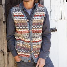 Our traditional hand knitted fairisle patterns in waistcoat form. Perfect over a shirt. Pachamama Mens hand knitted wool button up gilet vest. Traditional fair isle design for a classic look. Fair trade and handmade in Nepal. 100% Wool Unlined Hand knitted Coconut buttons Pockets at sides However, because our garments are handmade, we can experience slight variation in sizing. Have any exceptional size requests? Please place you order and message us in the 'Note to seller' Section. Washing Instructions: Dry Clean Only Pachamama has been designing and producing fairly traded woollens for 30 years. Check out more Pachamama Woolies here! - https://www.etsy.com/uk/shop/PachamamaWoollies?listing_id=792986773&ref=shop_overview_header&section_id=28478253 Fairisle Patterns, Luxury Men's Jacquard Knit Outerwear, Handmade Fair, G Man, Wool Wash, Fair Isle Pattern, Shell Buttons, Coconut Shell, Vest Outfits