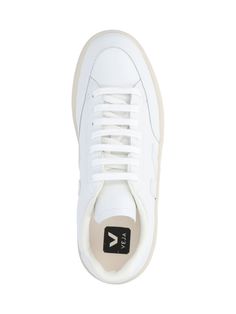 Veja V-12 sneakers in white leather with perforated round toe, laces, logo label on the tongue, tone-on-tone side logo detail, silver logo lettering on the back tab, cream rubber sole. Composition: 100% Leather Valentino Garavani Bag, Veja Sneakers, Versace Shop, Silver Logo, Saint Laurent Shoes, Marine Serre, Recycled Rubber, Synthetic Rubber, Luxury Dress