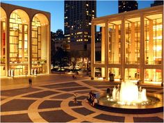 a fountain in the middle of a circular courtyard