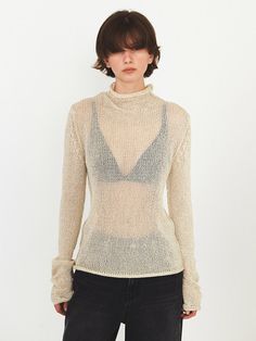 This is a modern and casual knit top by DIAGONAL that is made out of high quality and sturdy fabric. With unique design detail and trendy mood, you can style it for your clean and casual daily outfit.- Natural rolled neckline, cuffs, and hem- Sheer and light knit fabric- High neckline detail Modern Turtleneck Top For Layering, Chic Fitted Top Sweater For Spring, Chic Turtleneck Top, Chic Fitted Sweater For Spring, Spring Knit Tops For Workwear, Beige Stretch Fine Knit Top, Fitted Knit Tops For Work, Fitted Neutral Sweater For Spring, Chic Beige Fine Knit Sweater