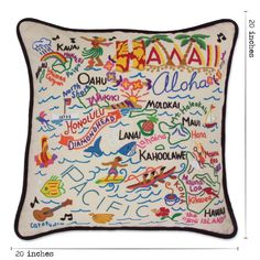 an embroidered pillow with the names of hawaii and other countries on it, in white