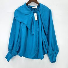 Anthropologie Blouse Womens Long Sleeve Button Down Asymmetrical Blue S Nwt Spring Asymmetrical Tops With Button Closure, Spring Top With Asymmetrical Hem And Button Closure, Summer Asymmetrical Tops With Button Closure, Asymmetrical Summer Tops With Button Closure, Asymmetrical Tops With Button Closure For Spring, Spring Asymmetrical Tops With Buttons, Spring Blouse With Asymmetrical Hem And Button Closure, Chic Asymmetrical Top With Button Closure, Chic Asymmetrical Tops With Button Closure