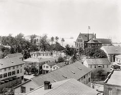 an old black and white photo of some buildings