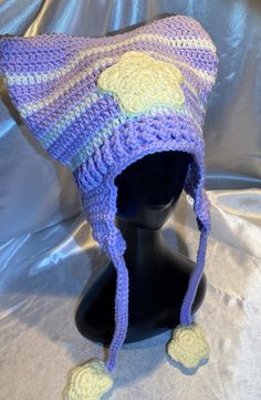 a crocheted hat on top of a mannequin head