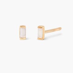 Try our Chloe Earrings. Each elegant stud is crafted with exquisite detail and glistens with subtle sophistication. Make a statement without the hassle and enjoy a lifetime of luxury with the ultimate fashion accessory. Ready to make a stunning impression? Try our Chloe Earrings today. Available in 14k gold vermeil and sterling silver Size: 2mm x 4mm 1.5mm x 3mm baguette cut white topaz crystal Stainless steel post with friction back SKU: BYE1119 Gold Timeless Earrings With Baguette Diamonds, Classic Gold Earrings With Baguette Diamonds, Classic Gold Baguette-cut Earrings, Classic Gold Baguette Cut Earrings, Fine Jewelry Baguette Cut Earrings For Pierced Ears, Elegant Gold Baguette-cut Earrings, Elegant Baguette Cut Gold Earrings, Elegant Gold Baguette Cut Earrings, Minimalist Earrings With Baguette Diamonds