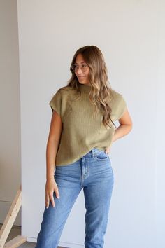 Stay cozy in this best-selling Prague Mock Neck Top! Crafted with organic cotton, it features a slouchy fit with a pocket. Its olive hue will be a stylish addition to your wardrobe. Experience this highly awaited restock—get yours now! How to style: Pair with your favorite pair of jeans for a relaxed yet cool girl vibe. About the product Olive in color Slouchy fit Pocket Mock Neck Knitted material 100% cotton Everyday Versatile Cotton Sweater, Versatile Everyday Cotton Sweater, Trendy Olive Tops For Winter, Green Tops For Casual Fall Gatherings, Oversized Olive Top For Fall, Fall Olive Crew Neck Top, Olive Crew Neck Top For Fall, Green Relaxed Fit Sweater With Pockets, Green Sweater With Pockets Relaxed Fit