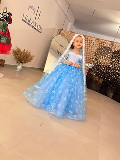 The package includes a dress, cape and accessories. This cool Elsa-inspired costume is back in stock. It is a special production, our product is made of the highest quality materials suitable for children's use... It is fully lined. This dress is handmade. Your little princesses will dazzle in this dress. Perfect for birthdays, photo shoots or parties. - All dresses are made to order. All dress pictures are 100% real product pictures! -You can check out our other Elsa models here. https://www.et Elsa Inspired Dress, Elsa Birthday Party, Costume Princess, Elsa Birthday, Dress Cape, Frozen Costume, Dress Pictures, Elsa Dress, Princess Elsa