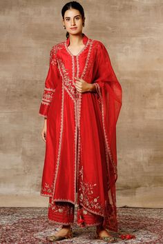 Red flared kurta with panelled floral motifs. Comes with palazzo pants and organza dupatta.
Components: 3
Fabric: Chanderi
Neckline: Mandarin collar
Sleeve Length: Full
Color: Red
Embroidered
Front slit
Embroidered dupatta with tassels
Closure: Kurta: Front buttons - Aza Fashions Red Kurta, Kurta Set For Women, Red Flare, A Line Kurta, Suits Design, Embroidered Dupatta, Party Suits, Indian Dress, Organza Dupatta