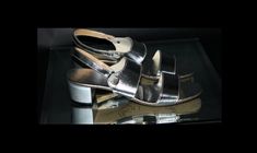 "If you're looking for a little glamour in your sandals, look no further.  Vintage 1970's sandals by \"Bertlyn\" New York, NY.  The bright, shiny silver finish on these shoes will add wonderful flair and style to your favorite 60's or 70's outfits.  The heel strap is elasticized for extra comfort and fit.  These shoes are in very good vintage condition but do have some scuffing on the heels and normal wear on the soles.  With summer just around the corner these are a must have.   Inside toe to heel - 9 & 1/2\" Bottom of ball -  2 7/8\" Heel - 1 7/8\" Please read my shop policies as I don't accept returns.  Should you have any questions please feel free to contact me and I will reply.  If you mark my shop as a favorite you will be able to see my updates." Retro Evening Sandals For Spring, Retro Formal Sandals For Summer, Retro Formal Summer Sandals, Vintage Ankle Strap Sandals For Party, Vintage Ankle Strap Sandals For Formal Occasions, Silver Vintage Heels For Party, Vintage Sandals With Round Toe For Evening, Retro Evening Sandals With Ankle Strap, Retro Ankle Strap Evening Sandals