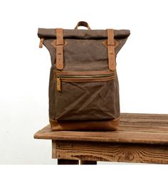 one Khaki Backpack With Zipper Closure, Khaki Backpack With Zipper Pocket For Travel, Khaki Travel Backpack With Zipper Pocket, Brown Canvas Backpack With Zipper Closure, Waxed Canvas Leather Backpack, Vintage Canvas Bags, Roll Top Backpack, Waxed Canvas Backpack, Vintage Leather Backpack