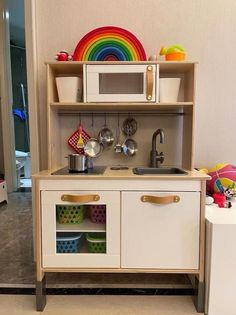 a toy kitchen with lots of toys in it