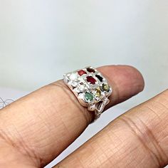 Genuine 925 Sterling Silver Navratan Ring Gemstone - Ruby , Emerald , Blue Sapphire, Yellow Sapphire, Hessonite, Cats Eye, Coral, Pearl, Cubic Zircona. Ring Size - QTY - 1 piece in this listing. The navratna or nine gems influencing the nine planets are: Ruby = Sun , Pearl = Moon, Red Coral = Mars, Emerald = Mercury, Yellow Sapphire = Jupiter, zircon = Venus, Blue Sapphire = Saturn, Hessonite = Rahu , Cat''s Eye = Ketu . Sterling Silver Multi-stone Open Ring, Unique Multi-stone Birthstone Promise Ring, Sterling Silver Multi-stone Round Ruby Ring, Spiritual Sterling Silver Rings With Accent Stones, Silver Spiritual Birthstone Ring With Accent Stones, Silver Crystal Ring With Accent Stones For Jewelry Making, Unique Multi-stone Cluster Ring Gift, Sterling Silver Multi-stone Ruby Ring, Gift Multi-stone Ruby Ring In White Gold