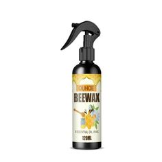 a bottle of beewax essential oil next to a black sprayer on a white background