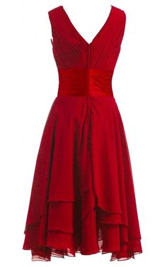 a red dress is shown on a mannequin