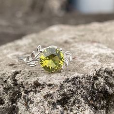 Natural Peridot Ring, An Unique Ring for Women. If you are looking for a Peridot Ring Vintage, August Birthstone Ring, Peridot Ring For Women, or Gemstone Rings Sterling Silver, this ring will be an excellent choice. This  Peridot ring is a gift from the heart of Mother Nature and comes with a ton of healing properties. Deep-set calm, good health, restful slumbering, and restoring balance and harmony to the body, mind, and soul. Ring in Detail: - Gemstone: Peridot, Round Cut. - Stone size: 8mm - Material: S925 solid silver - Available in US Sizes 5, 6 7, 8, 9, 10, 11, and 12  for the most optimal fit.   HOW TO MEASURE YOUR RING SIZE: RINGS are generally measured using the diameter, the easiest way to determine this is by measuring a ring you already own, or you can follow these steps: - Ta Green Topaz Ring With Center Stone, Sterling Silver Rings With Lime Green Accent Stones, Lime Green Sterling Silver Rings With Accent Stones, Green Solitaire Crystal Ring In Sterling Silver, Green Sterling Silver Topaz Ring, Green Topaz Ring With Accent Stones, Green Peridot Rings With Round Stone, Peridot Birthstone Rings With Round Stones, Green Solitaire Crystal Ring