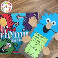 two children's books on a table, one with an image of sesame and the cookie monster