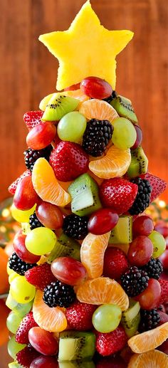 a christmas tree made out of fruit is shown